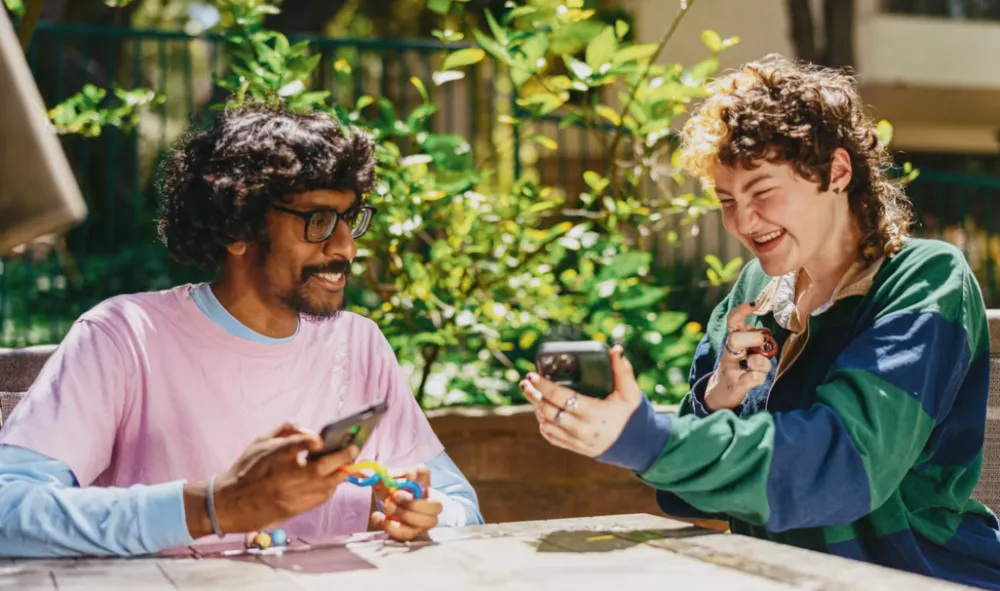 Two friends using laughing together - Photo by Hiki App on Unsplash Understanding Neurodiversity header image