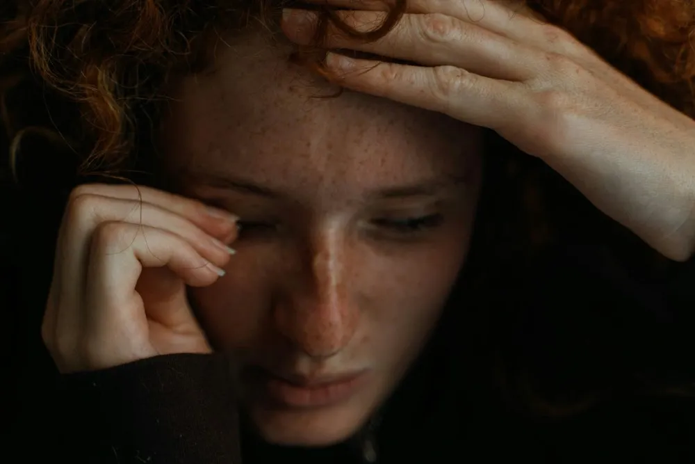 An upset women looking at the floor