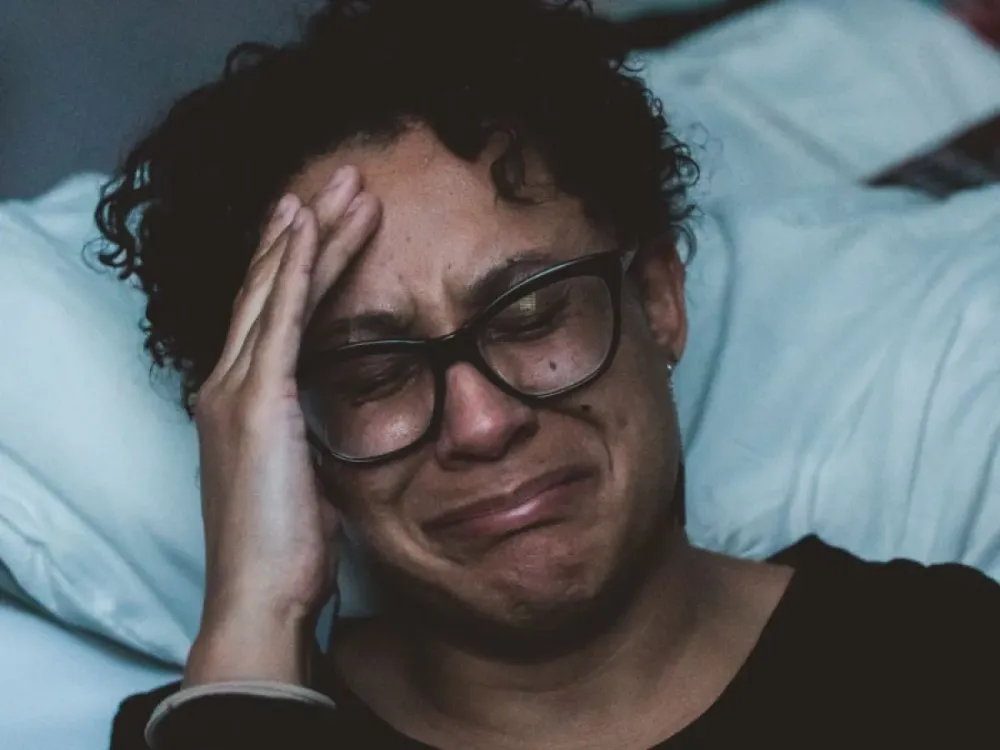 A women laying awake in bed